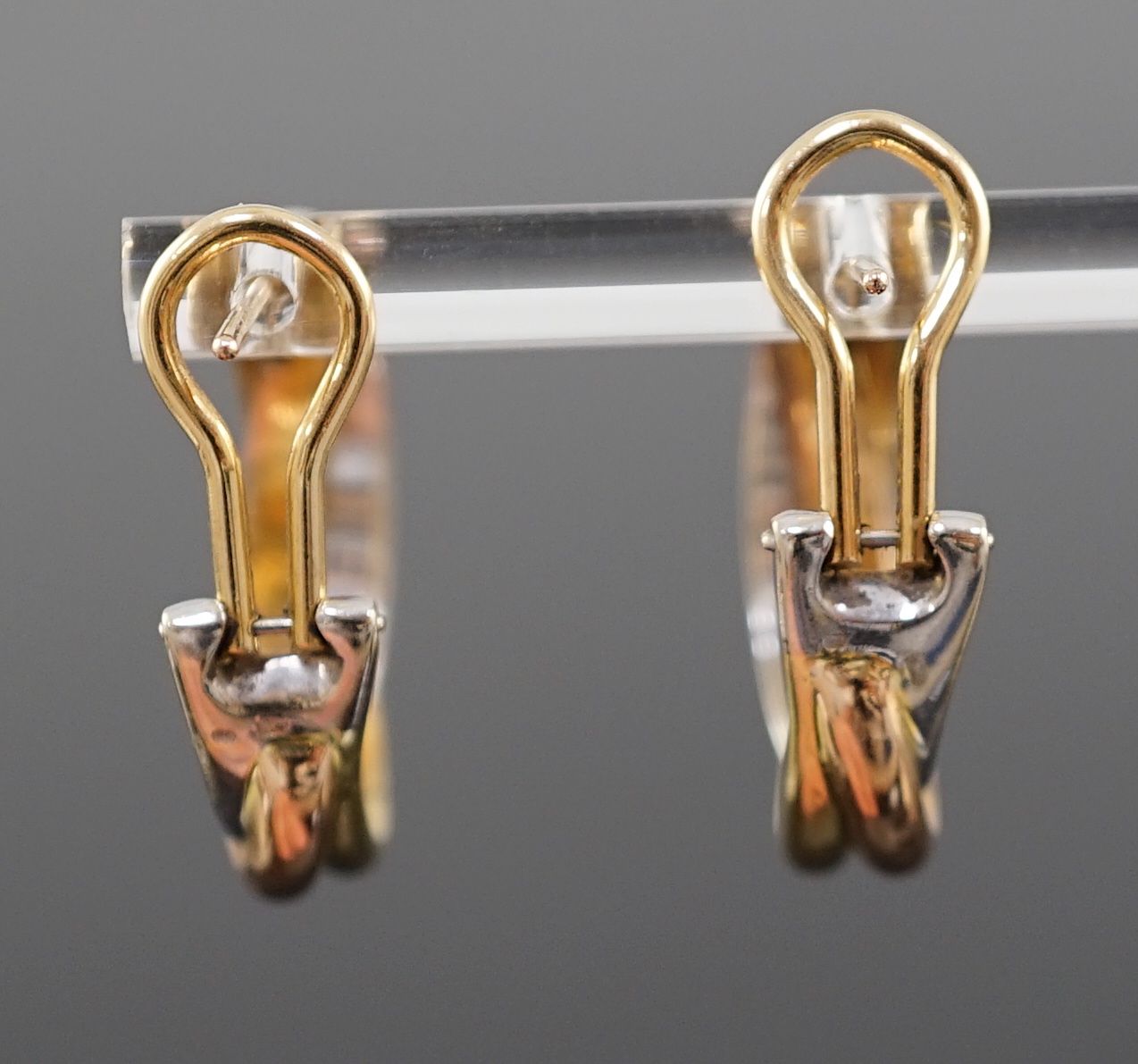 A modern pair of Cartier three colour 18ct gold Trinity earrings